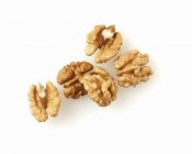 Several unshelled walnuts — Stock Photo