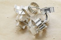 Closeup view of assorted biscuit cutters on frame — Stock Photo