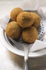 Falafel chickpea balls on slotted spoon — Stock Photo
