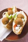 Serving of flatbread filled with falafel — Stock Photo