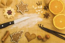 Christmas biscuits and baking ingredients — Stock Photo