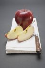 Apple and two apple wedges — Stock Photo