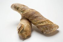 Rustic freshly baked baguettes — Stock Photo