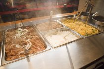 Trays with pulled pork and rices — Stock Photo