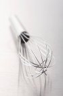 Closeup view of a whisk on a metal surface — Stock Photo