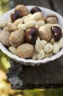Walnuts chestnuts and peanuts — Stock Photo