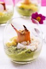 Guacamole with crab in glass bowl over table — Stock Photo