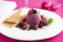 Raspberry mousse with fresh berries — Stock Photo