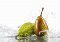 Two pears in water — Stock Photo