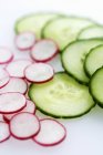 Slices of cucumber and radish — Stock Photo