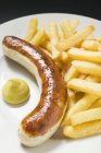 Currywurst sausage with mustard — Stock Photo