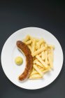 Currywurst sausage with mustard — Stock Photo