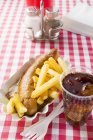 Currywurst sausage with ketchup and curry powder — Stock Photo