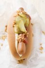 Hot dog with gherkin and ketchup — Stock Photo
