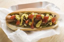 Hot dog with mustard and onions — Stock Photo