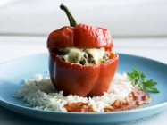 Pepper stuffed with minced meat on rice — Stock Photo