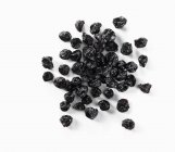 Dried blueberries on white — Stock Photo