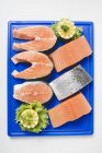 Fresh salmon fillets and salmon cutlets — Stock Photo