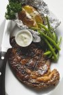 Grilled beef steak with baked potato — Stock Photo