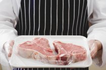 T-bone steaks on tray — Stock Photo