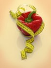 Red pepper with tape measure — Stock Photo