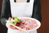 Raw ham and salami — Stock Photo