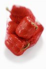 Net bag with red peppers — Stock Photo
