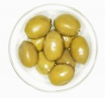 Green olives in small bowl — Stock Photo