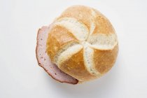 Slices of Leberkse meatloaf in bread roll — Stock Photo
