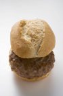 Burger in bread roll — Stock Photo