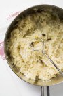 Sauerkraut in pan from above in dish over towel — Stock Photo