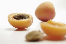 Fresh apricot with halves — Stock Photo