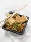 Tofu with vegetables in take away container — Stock Photo