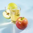 Glass of apple schorle — Stock Photo