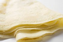 Closeup view of one folded crepe on white surface — Stock Photo