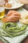 Colorful homemade ribbon pasta on napkin — Stock Photo