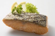 Grilled salmon fillet with greenery — Stock Photo