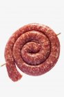 Raw coiled sausage — Stock Photo