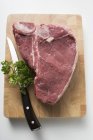 T-bone steak on board — Stock Photo