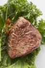 Roasted fillet of beef with greens — Stock Photo