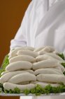 Chef holding tray of Weisswurst sausages — Stock Photo
