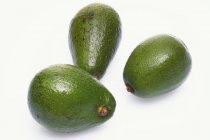 Three whole avocados — Stock Photo