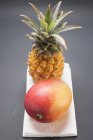 Pineapple and ripe mango — Stock Photo