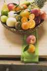 Assortment of fresh fruits in basket — Stock Photo
