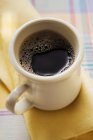 Mug of black coffee — Stock Photo