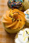 Colorful decorated muffins — Stock Photo