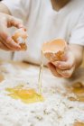 Child making pasta dough — Stock Photo