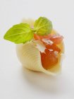 Pasta shell filled with diced tomato — Stock Photo