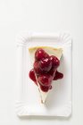 Cheesecake with cherry sauce — Stock Photo