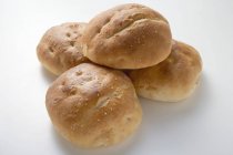 Baked sesame buns in heap — Stock Photo